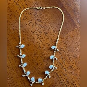 Gold-tone necklace with faux pearls and rhinestones